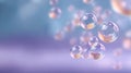 Transparent bubbles with soft peach centers floating in a dreamy blue and purple gradient background with a shallow depth of field Royalty Free Stock Photo