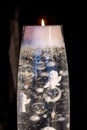 Transparent candle with angel and hearts in candle wax