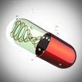 Transparent capsule on gray background