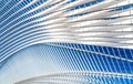 Transparent ceiling in modern railway station with blue sky