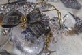 Transparent Christmas balls filled with snow and with the birth of jesus and golden bows Royalty Free Stock Photo