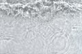 Transparent clear calm water surface texture with waves, splashes and bubbles. Trendy abstract nature background. White Royalty Free Stock Photo