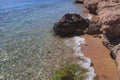 Transparent and clear waters of Red Sea. Rocky shore. Surf Royalty Free Stock Photo