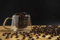 A Cup of coffee beans on old black background