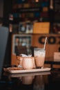 Transparent coffee cup Hot cappuccino on the table in a coffee shop with people