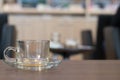 Transparent coffee cup on the wooden table