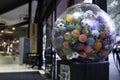 Transparent coin vending machine with colored plastic balls inside Royalty Free Stock Photo