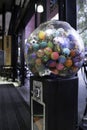 Transparent coin vending machine with colored plastic balls inside Royalty Free Stock Photo