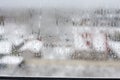 Transparent condensate in the foggy background, water dripping on clear glass. Drops of condensation close-up macro. Steam on the Royalty Free Stock Photo