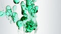 Transparent cosmetic green blue oil bubbles and shapes on white background Royalty Free Stock Photo