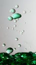 Transparent cosmetic green blue oil bubbles and shapes on white background Royalty Free Stock Photo