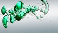 Transparent cosmetic green blue oil bubbles and shapes on white background Royalty Free Stock Photo