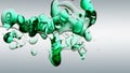 Transparent cosmetic green blue oil bubbles and shapes on white background Royalty Free Stock Photo