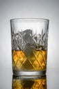Transparent crystal glass with drink and ice, advertising photography, selective focus Royalty Free Stock Photo