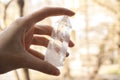 Transparent crystal of mountain quartz in a hand