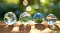 Transparent crystal spheres filled with sunlight in a green forest. Planet Earth and landscapes are reflected the glass Royalty Free Stock Photo