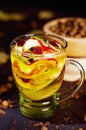 Transparent cup of infusion tea with colorful herbal selection inside, beautiful arrangement, teas and herbs concept