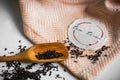 Transparent Cup of tea brewed with adjacent wooden spoons. Cinnamon sticks. Tea time. Tea leafs, Flat Lay