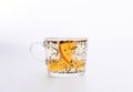 Transparent cup of tea with slice of orange isolated on white Royalty Free Stock Photo