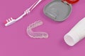 Transparent customized teeth bite guard clear aligners for lower jaw with storing case, tooth brush and paste Royalty Free Stock Photo