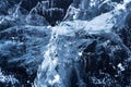 Transparent dark blue ice of frozen Baikal lake with white cracks pattern. Royalty Free Stock Photo