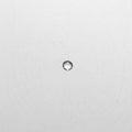 A transparent drop of water in the center of a spider web on a light background. Space for text. Royalty Free Stock Photo