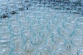 Transparent empty glass bottles in a bottling plant, on a production line in a factory or for sale in a store Royalty Free Stock Photo