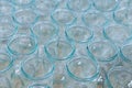 Transparent empty glass bottles in a bottling plant, on a production line in a factory or for sale in a store Royalty Free Stock Photo