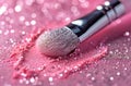 a transparent eyeshadow brush against pink paper with glitter splatter