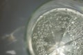 transparent faceted glass with bubbly water Royalty Free Stock Photo