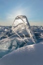 Transparent figured ice blocks in soft morning light