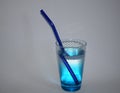 Transparent glass and blue glass with blue drinking straw, zero waste, on white background