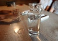 Transparent glass carafe with water on a table Royalty Free Stock Photo