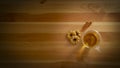 Transparent glass cup with herbal tea and side biscuits resting on a wooden table Royalty Free Stock Photo