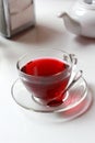 Transparent glass cup of red fruit tea on the Royalty Free Stock Photo