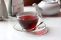 Transparent glass cup of red fruit tea on the Royalty Free Stock Photo