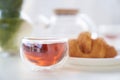 Transparent glass Cup of tea in nature. The concept of breakfast in the backyard of the house. Early morning, tea and Royalty Free Stock Photo