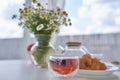 Transparent glass Cup of tea in nature. The concept of breakfast in the backyard of the house. Early morning, tea and Royalty Free Stock Photo