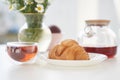 Transparent glass Cup of tea in nature. The concept of breakfast in the backyard of the house. Early morning, tea and Royalty Free Stock Photo