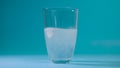 Transparent glass Cup of water drops analgin tablet