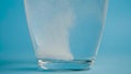 Transparent glass Cup of water drops analgin tablet