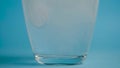 Transparent glass Cup of water drops analgin tablet