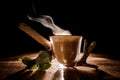 Transparent glass of a delicious hot coffee on the dark background