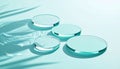 Transparent glass discs on a blue water surface with caustic light reflections Royalty Free Stock Photo