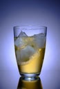 Transparent glass with drink and ice, advertising photography, selective focus Royalty Free Stock Photo