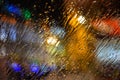 On transparent glass, drops of water flow down from the rain from the street. Royalty Free Stock Photo