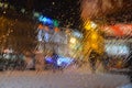 On transparent glass, drops of water flow down from the rain from the street. Royalty Free Stock Photo