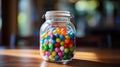 A transparent glass jar filled with colorful marbles Royalty Free Stock Photo