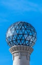 Transparent glass and metallic spherical dome of the highest part of a classic tower as if it were an astronomical observatory,