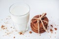 Transparent glass of milk and cookies on a white background Royalty Free Stock Photo